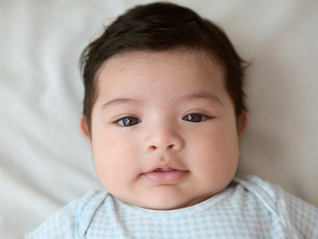baby against a white sheet