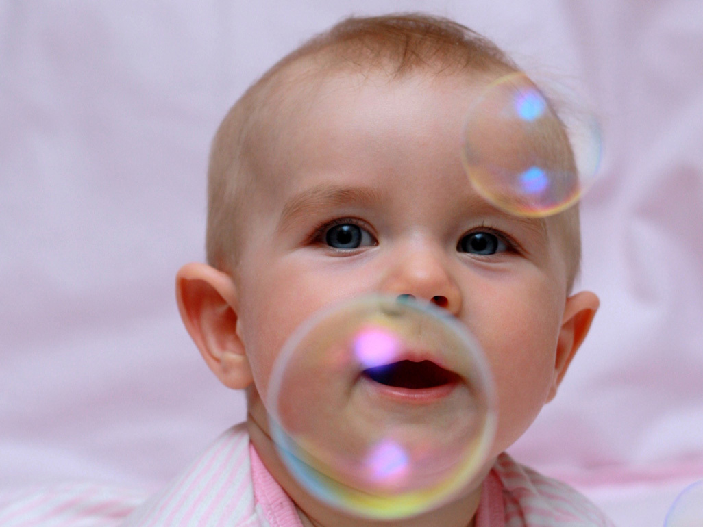 Baby playing with bubbles