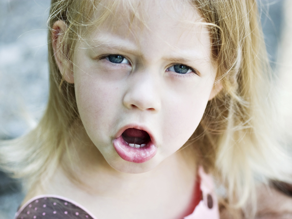 Young girl looking cross