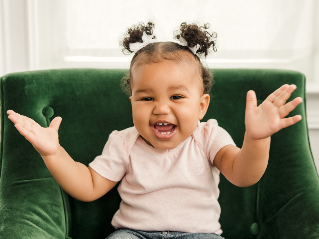 Toddler laughing and clapping