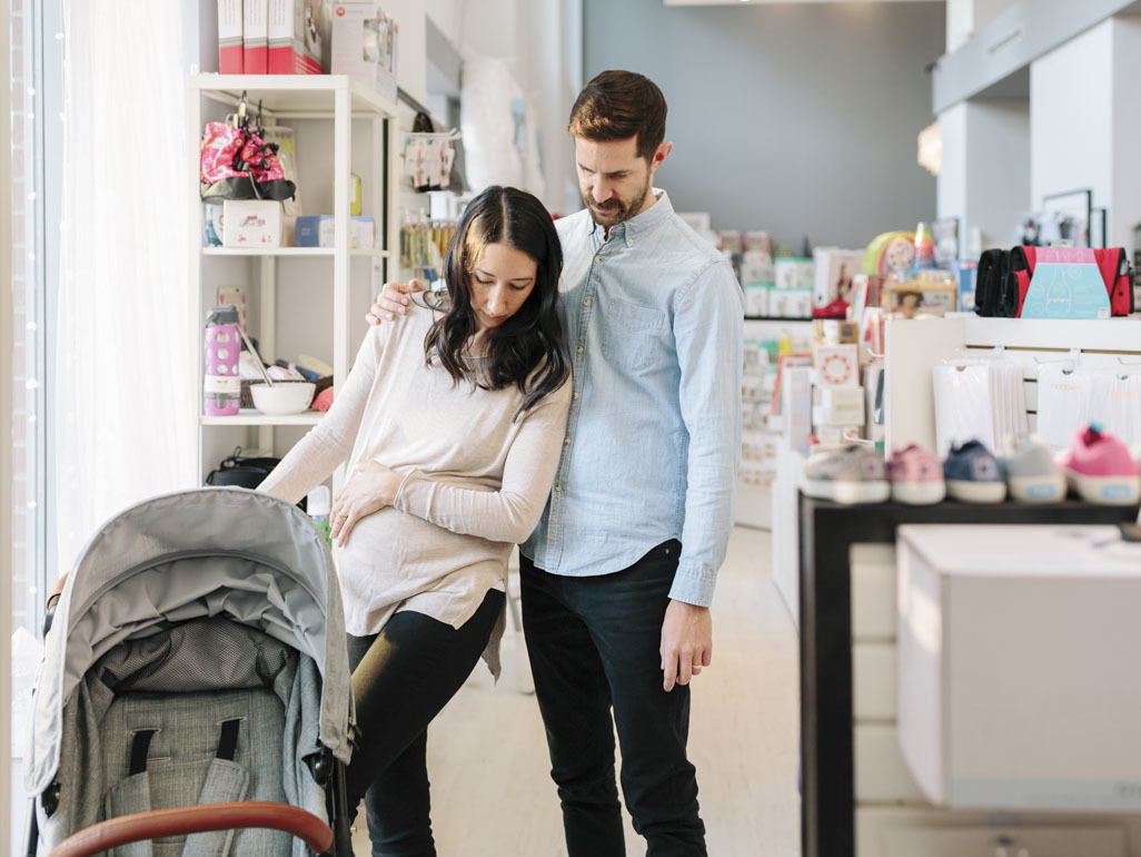 Couple shopping for stroller