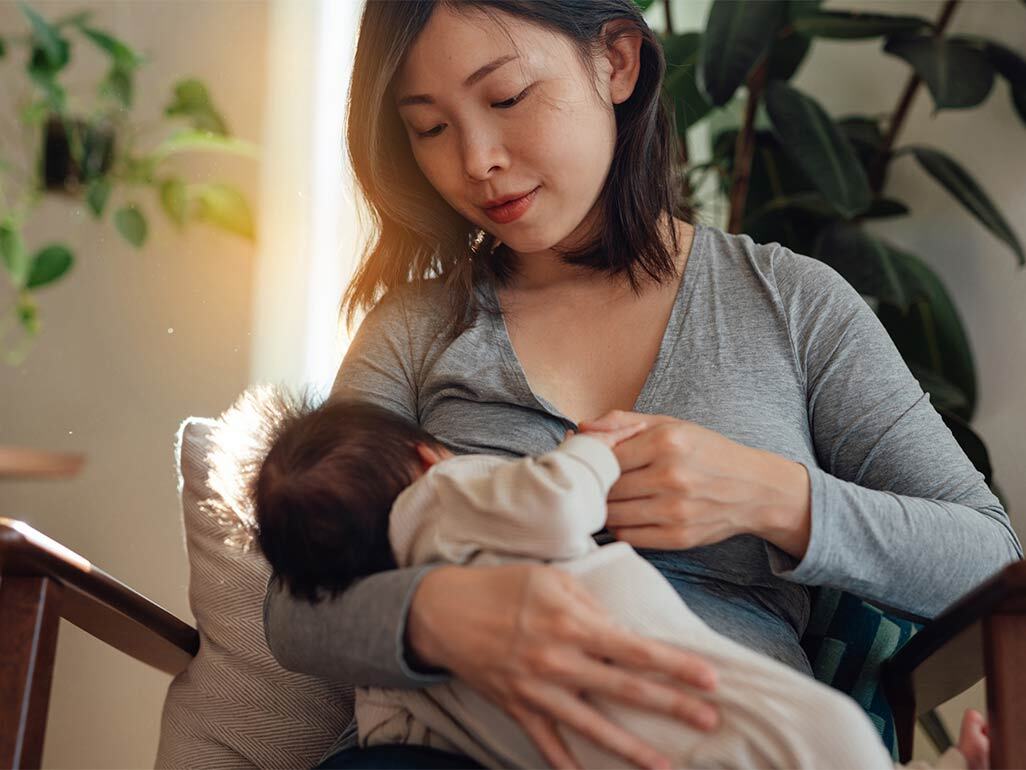 Mum breastfeeding newborn
