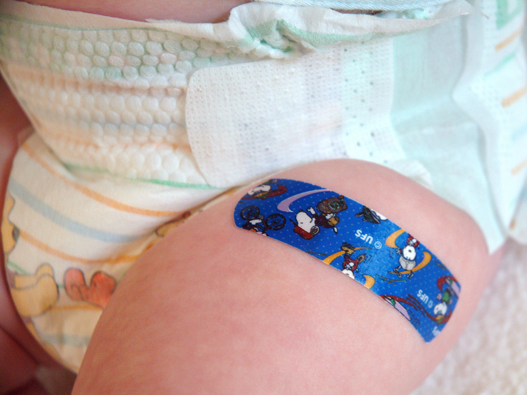 Close-up of sticking plaster on a baby's leg