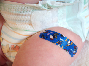 Close-up of sticking plaster on a baby's leg