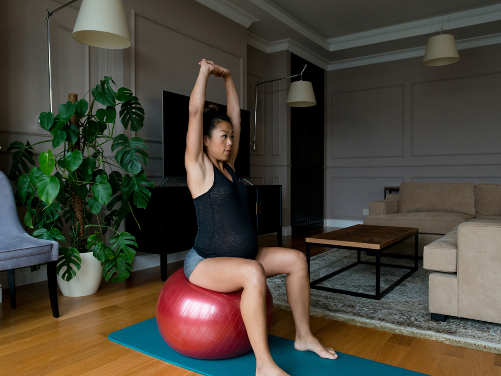 Pregnant woman sitting on a pregnancy ball 