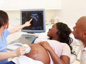 Pregnant woman having scan