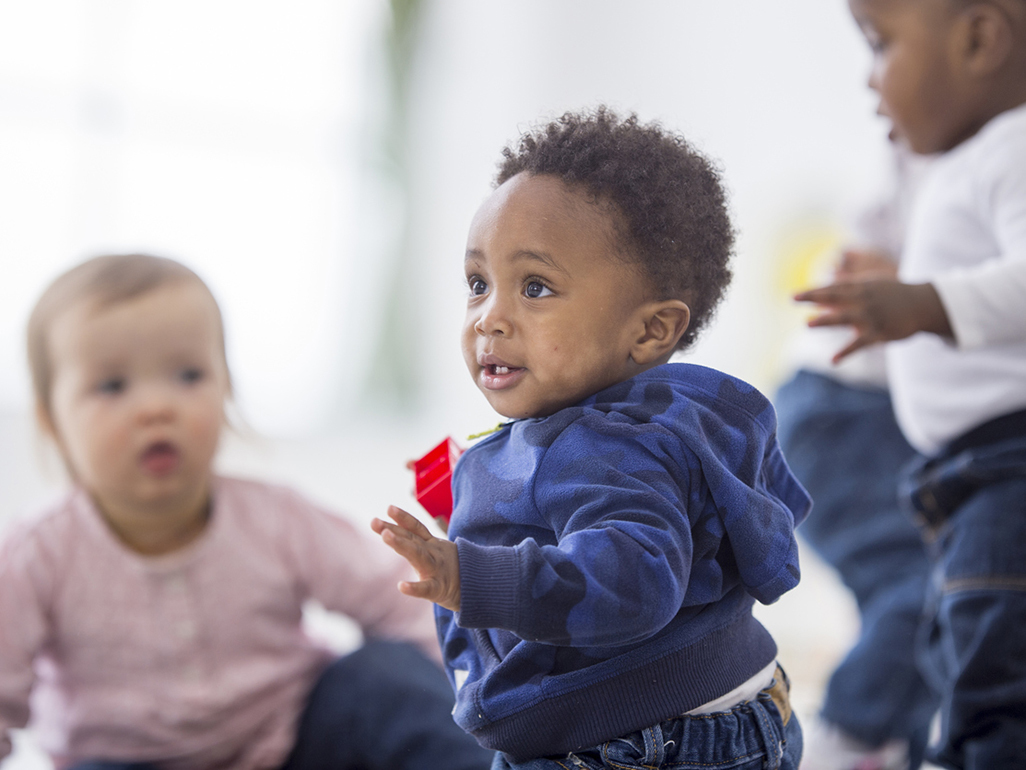 Toddlers playing with building bricks