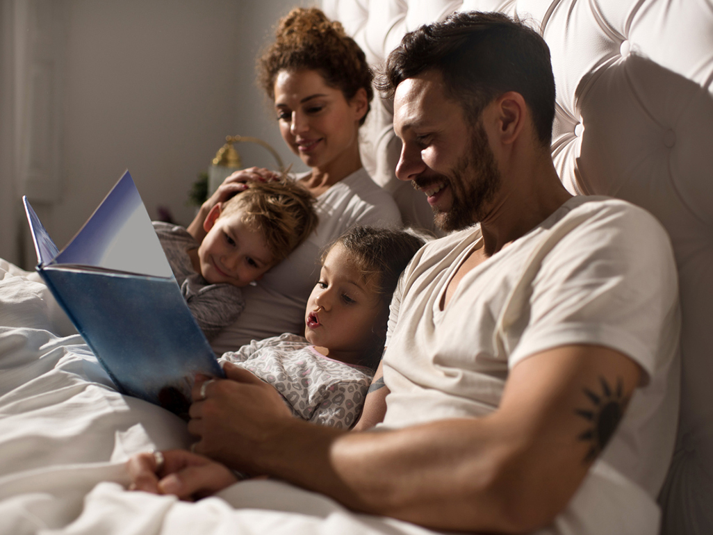 Dad and mum reading to children