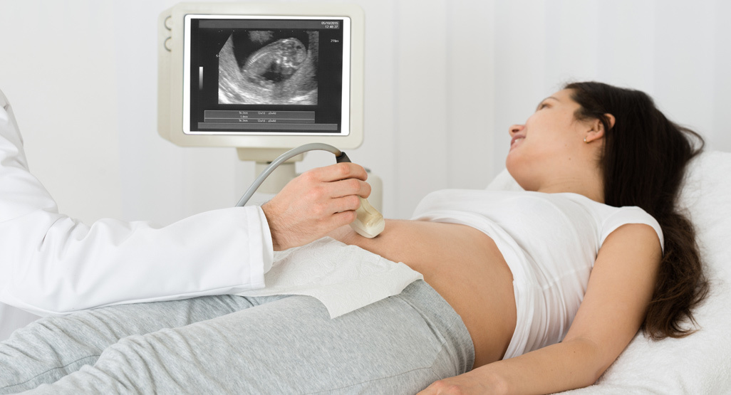 Pregnant woman having a scan