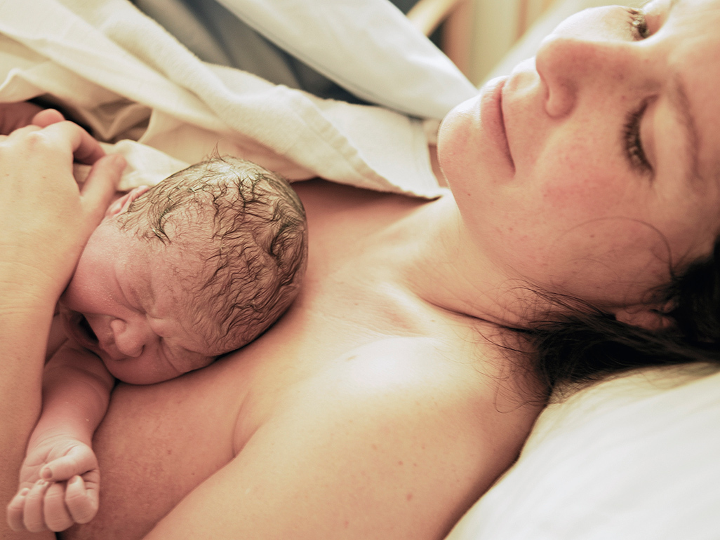 Woman holding her newborn baby