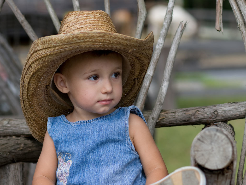 Baby wearing a straw hat