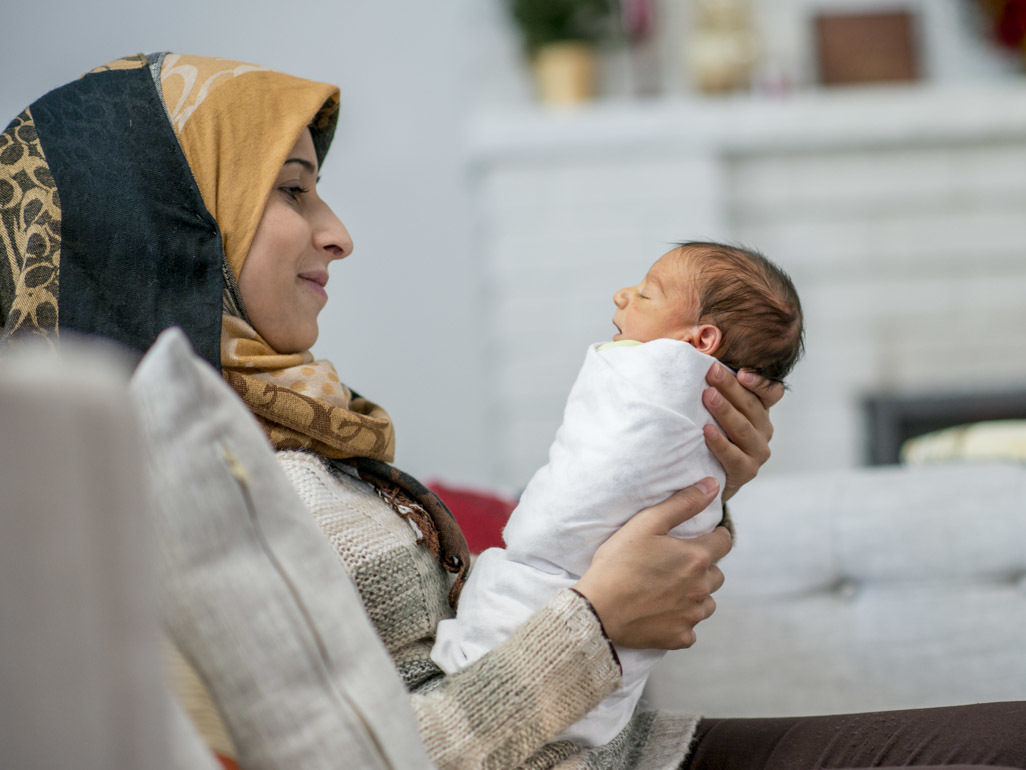 A mum holding her baby